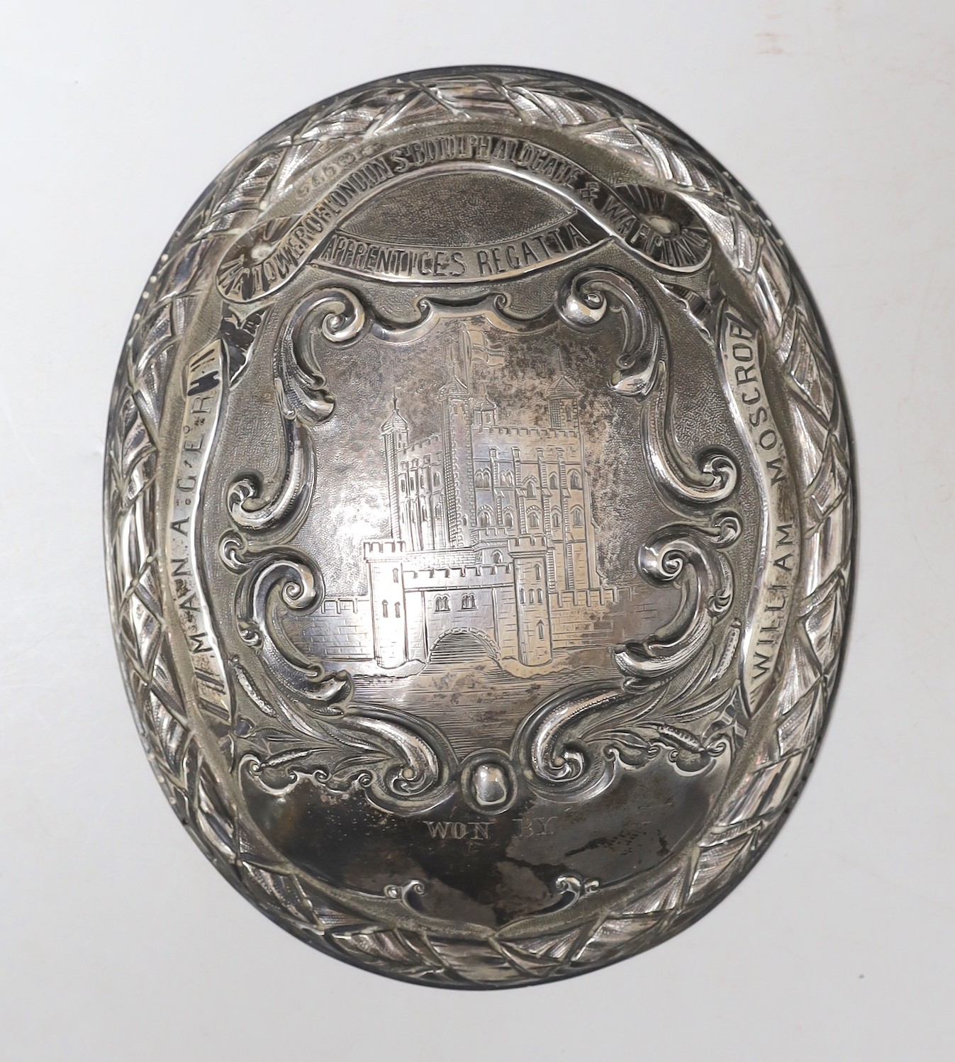 A Victorian silver oval plaque, with engraved inscription relating to 'The Tower of London St. Botolph Aldgate and Wapping Apprentices Regatta (Manage William Moscop), by S. Smith & Son, London, 1881, 17.1cm, 5oz.